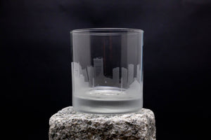 a glass sitting on top of a rock