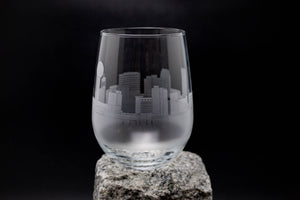 a wine glass sitting on top of a rock