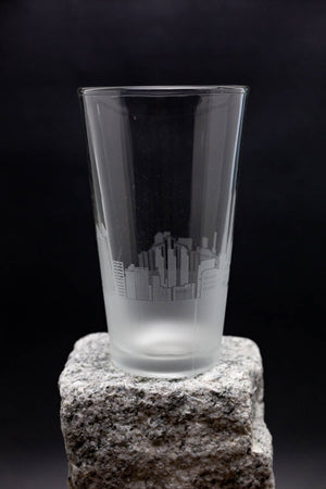 a glass sitting on top of a rock