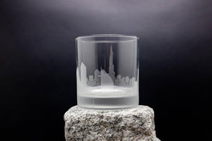 a glass sitting on top of a rock