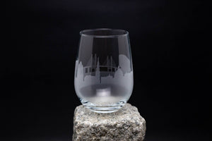 a glass sitting on top of a rock