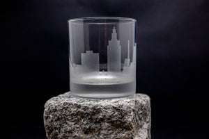 a glass sitting on top of a rock