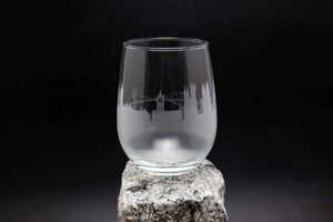 a glass sitting on top of a rock