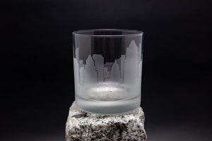 a glass sitting on top of a rock