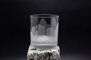 a glass sitting on top of a rock