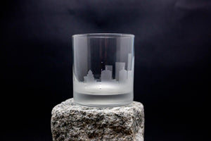 a glass sitting on top of a rock