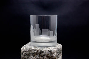 a glass sitting on top of a rock