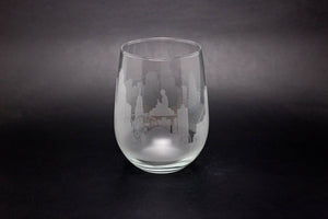 a wine glass with a picture of a castle on it