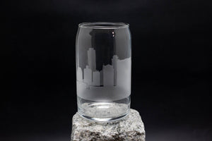 a glass on a rock with a black background