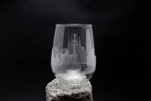 a glass with a castle etched on it