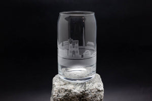 a clear glass sitting on top of a rock