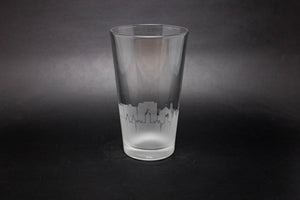a shot glass with a city skyline etched on it