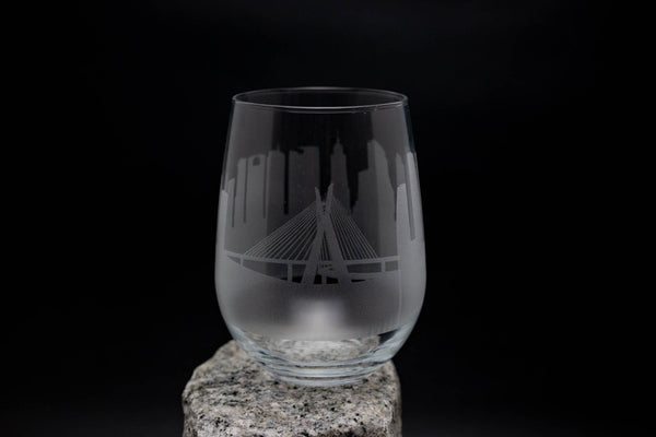 a wine glass sitting on top of a rock