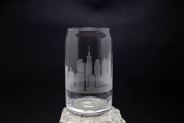 a glass with a city skyline etched on it