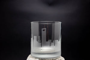 a shot glass with a city skyline etched on it