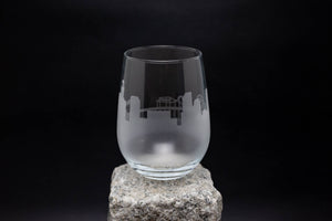 a glass sitting on top of a rock